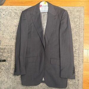 This is a 3 piece Tiglio suit in a size 38R/32.